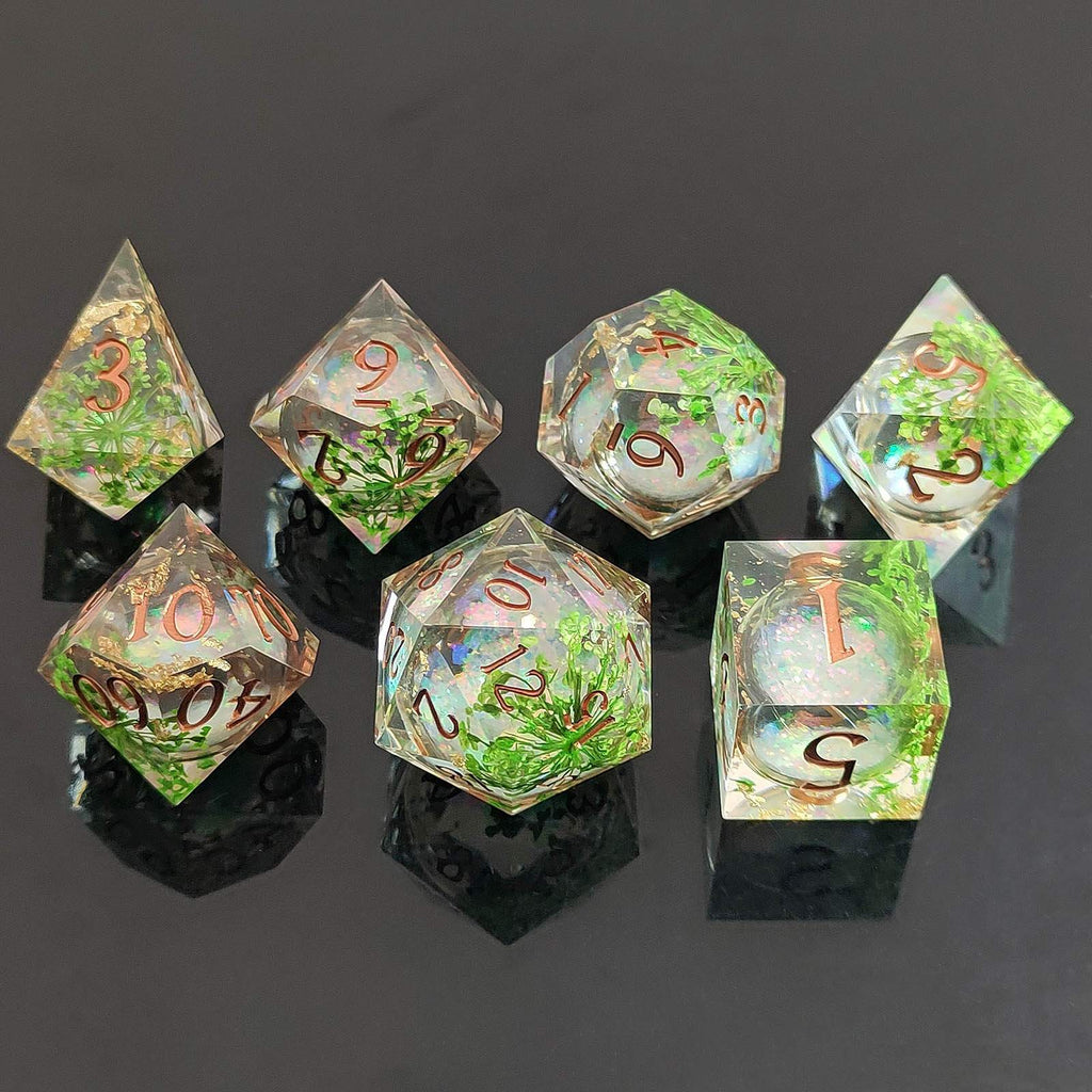 Set of transparent dice with green and brown numbers on a dark background