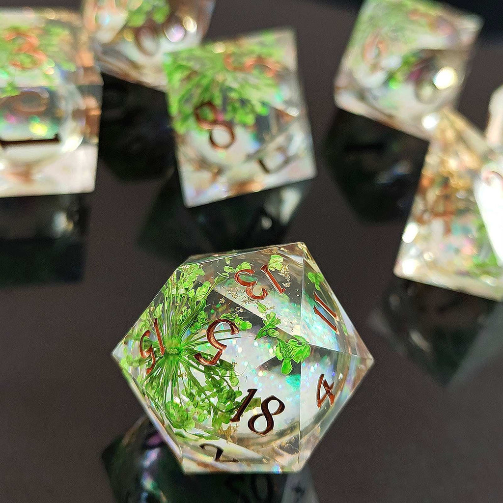 Hexagonal crystal dice with engraved numbers on a reflective surface