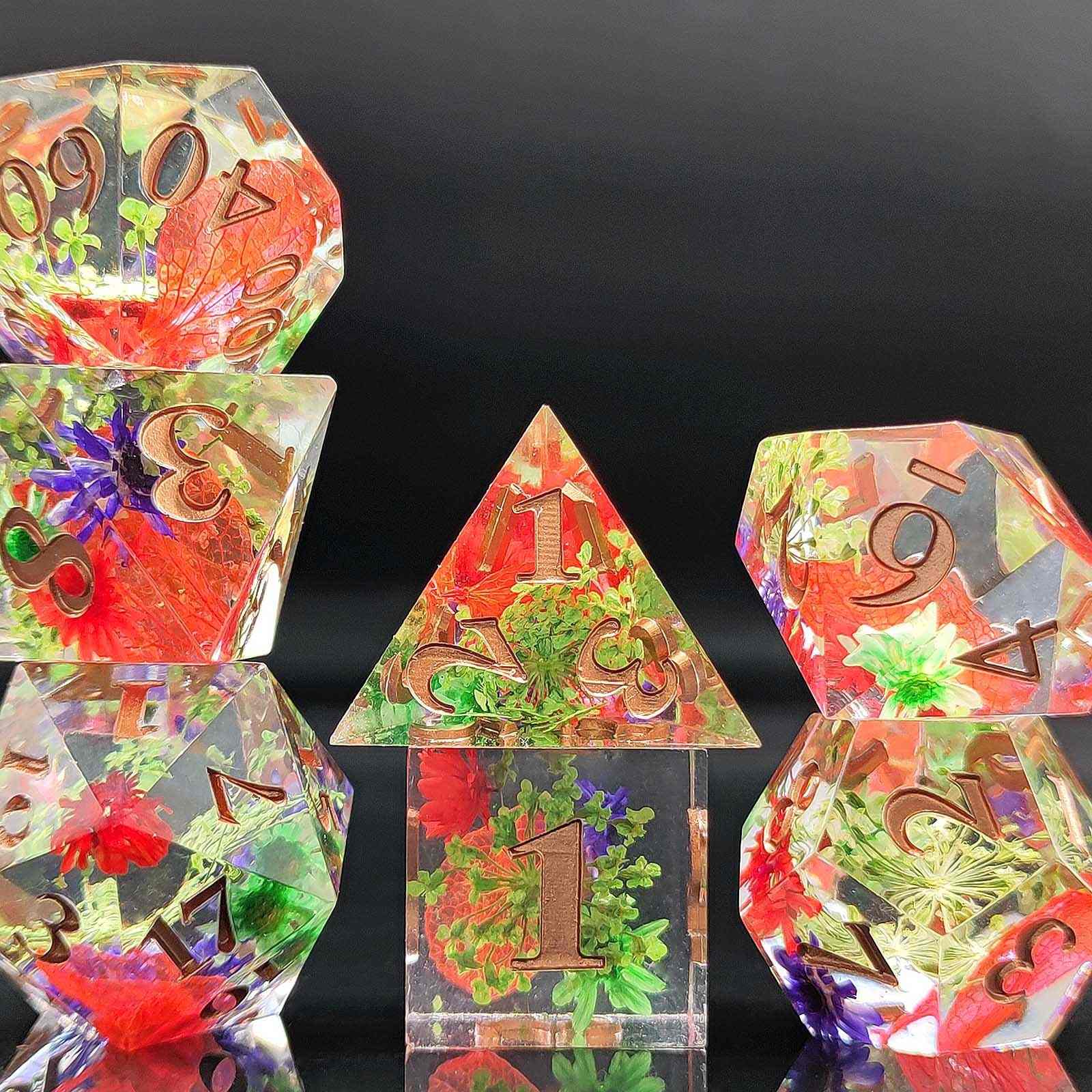 Colorful crystal botanical resin dice with numbers and symbols on a black background