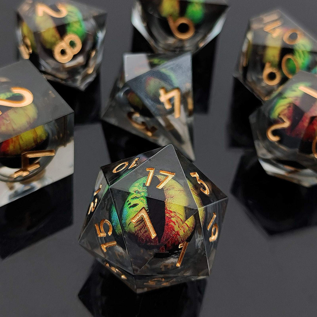Set of Liquid Core DND Dice with colorful interior and gold numbers on a reflective surface.