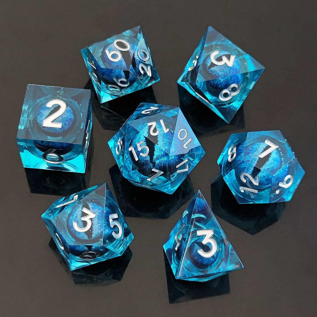 Set of blue transparent Dragon Eye Liquid Core DND Dice with numbers on a dark background