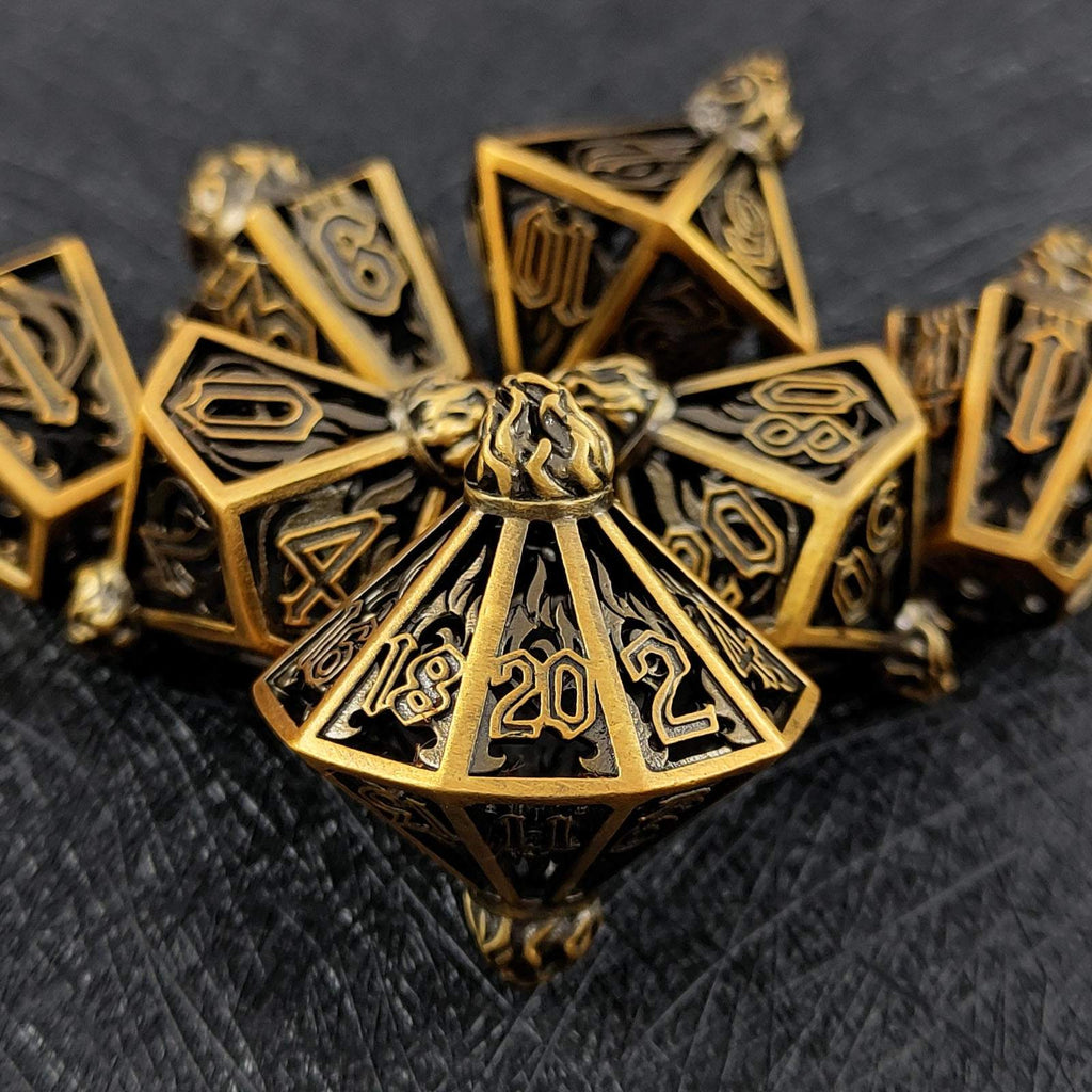 Gold lantern shaped metal hollow polyhedral dice set with '2022' on a dark textured background