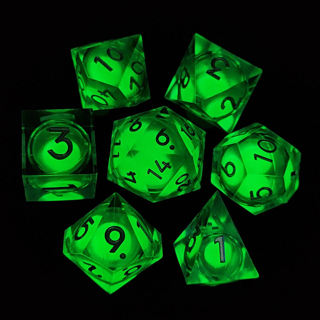 Set of green liquid core dice with numbers on a black background