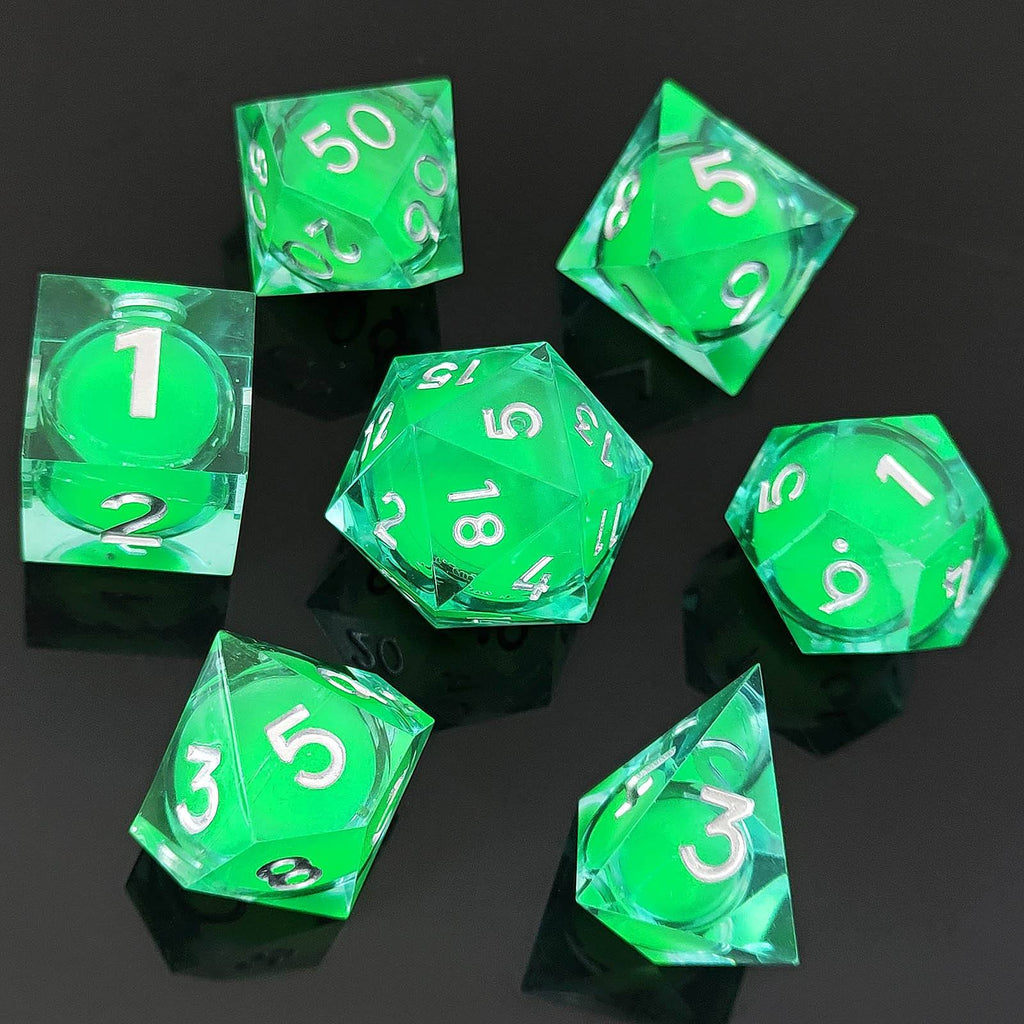 Set of green polyhedral Glow-in-the-Dark Liquid Core dice with white numbers on a black background