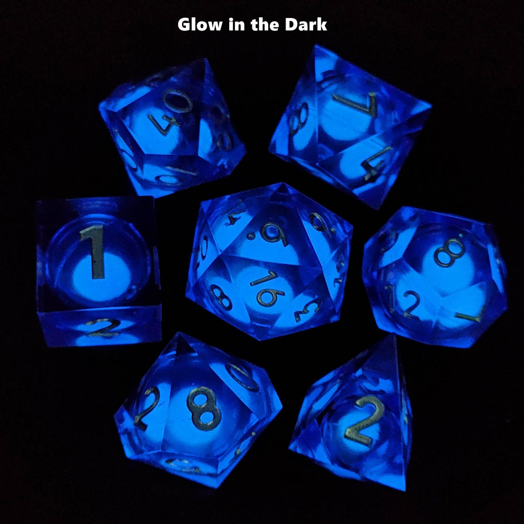 Set of blue dice with glowing effect on a black background