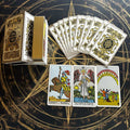 Set of tarot cards with Golden Ornate Crest Baroque and Gold Glitter Gilded Edges on a decorative background with 'Knight of Wands' and 'Temperance' cards displayed.