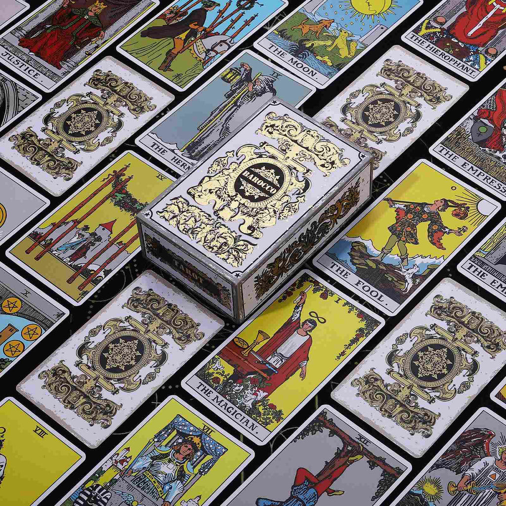 Collection of tarot cards with Golden Baroque Ornate Crest and Gold Glitter Gilded Edges, and a decorative box on a black background
