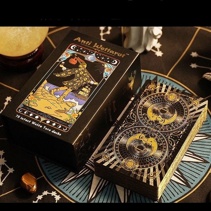 Anti Weffaron premium gold foil tarot card deck with packaging on a mystical background