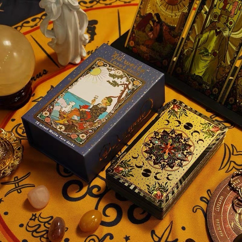 Kaleidoscope Holographic Rainbow Foil tarot cards and storage boxe on a decorative surface with tarot cards and crystals.