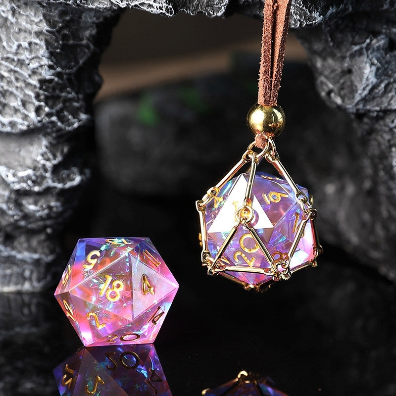 Multicolored polyhedral die charm with gold accents on a dark textured background