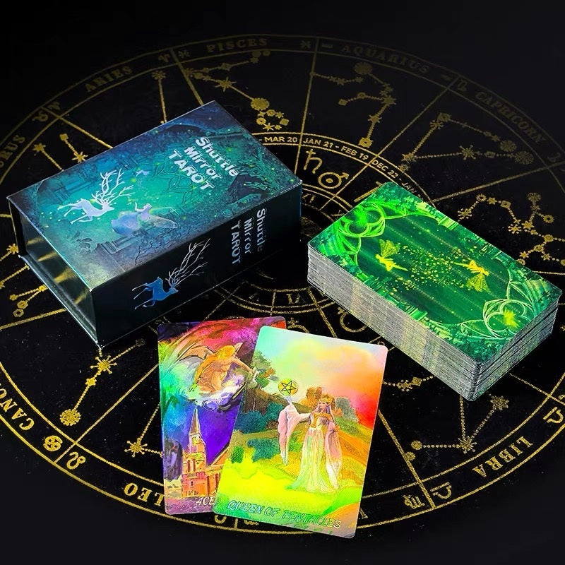 Glowing Laser Etched tarot cards and boxes on a black background with astrological symbols.