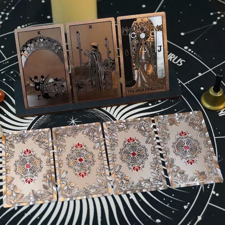 Set of tarot cards on a starry night background with decorative elements.