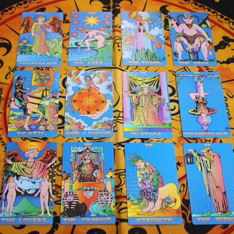 Collection of tarot cards on a colorful patterned surface