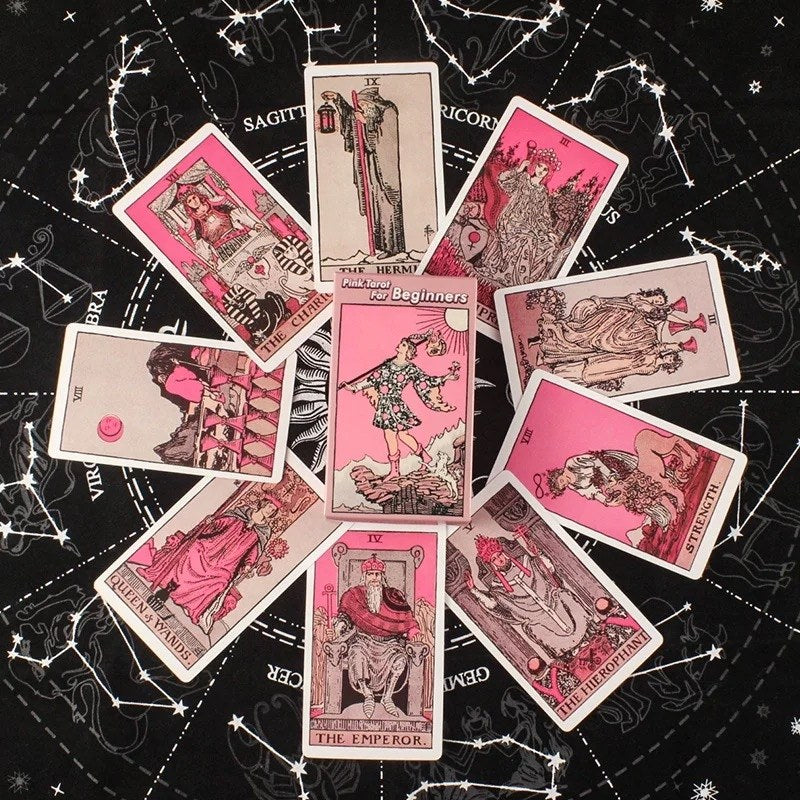 Collection of pink tarot cards on a starry night sky background