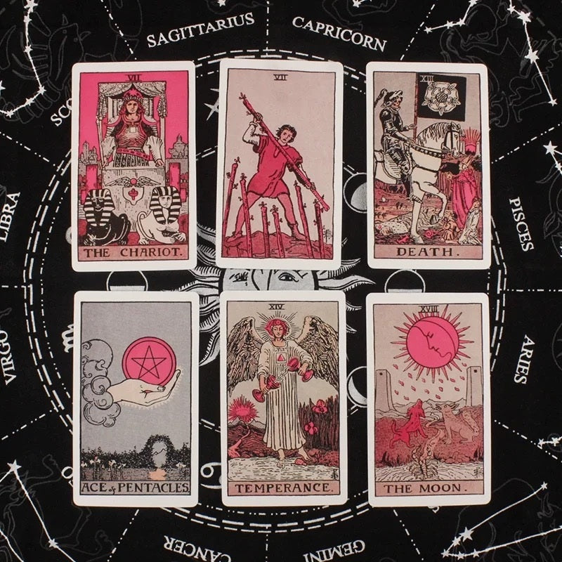 Set of pink tarot cards on a zodiac wheel background