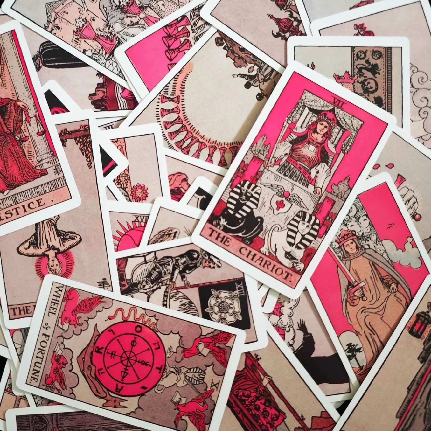 Collection of pink tarot cards with red and beige design