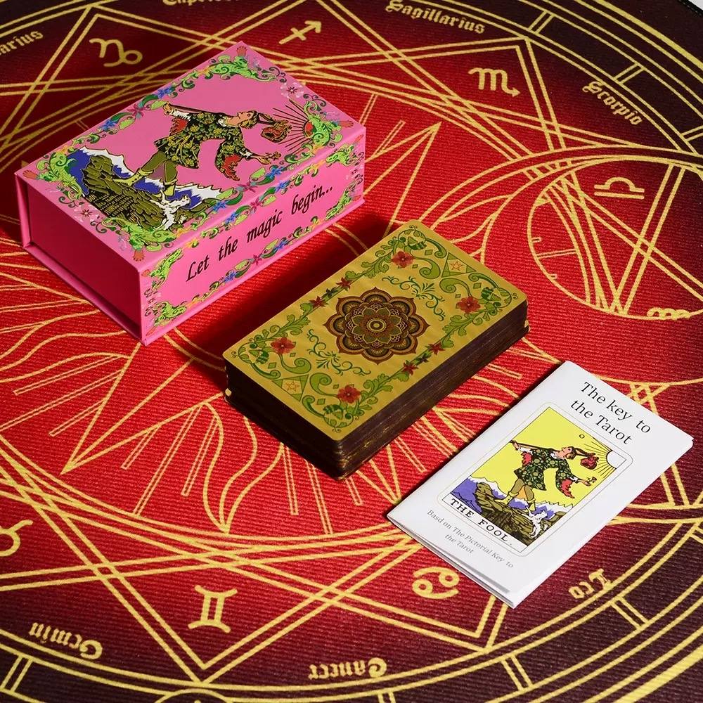 Pink & Gold Foil Mandala tarot card box and cards on a red tarot card background