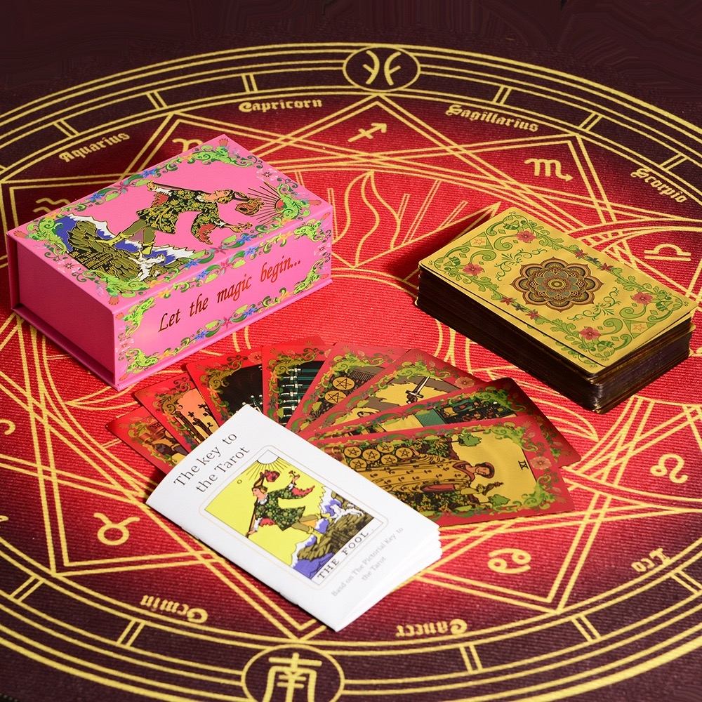 Pink & Gold Foil Mandala tarot card set with a pink box on a red astrological symbol background