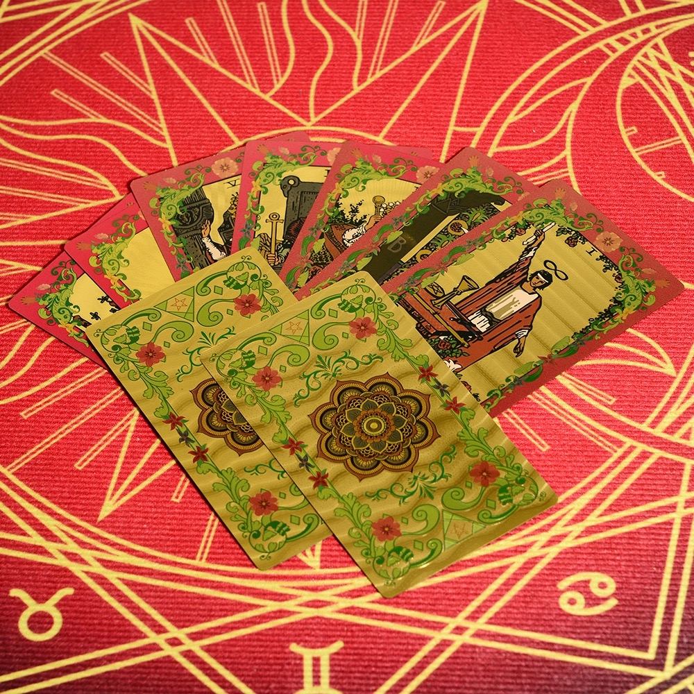 Set of Pink & Gold Foil Mandala tarot cards on a red and gold astrological design background