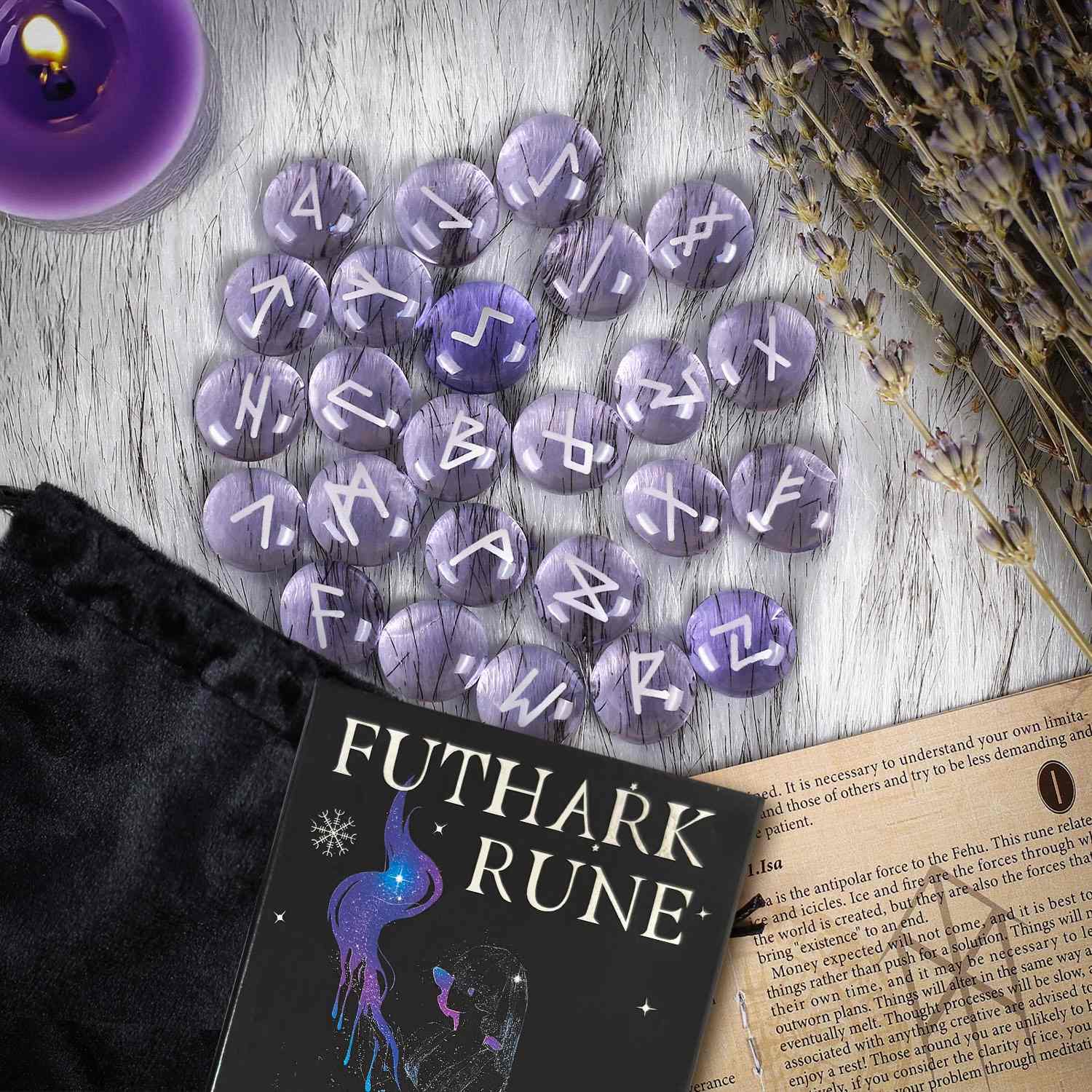 Purple Futhark Rune stones on a wooden surface with a book and candle.