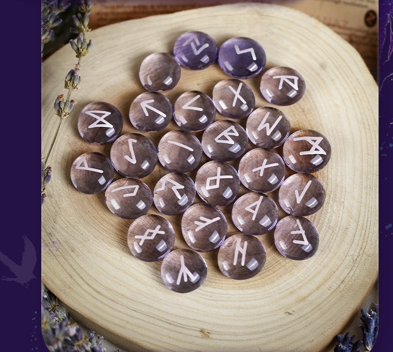 Amethyst stones withRunes on a wooden surface