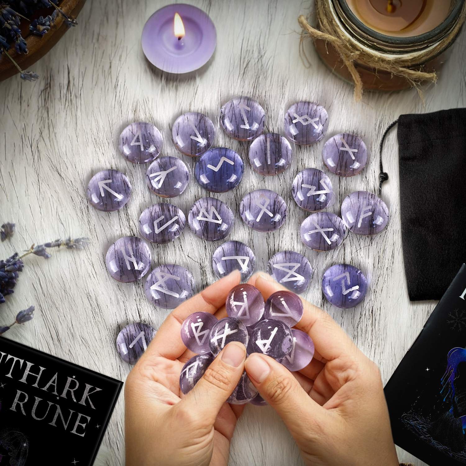 Purple Runes on a wooden surface with hands holding some runes.