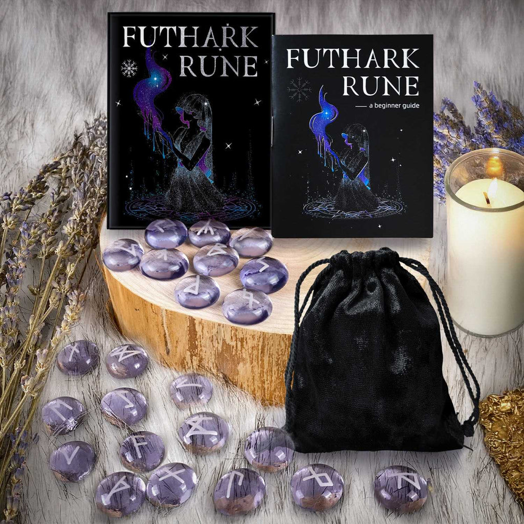 Futhark Rune set with urple Glaze Witch Stone rune stones, guidebook, and black drawstring bag on a wooden surface.