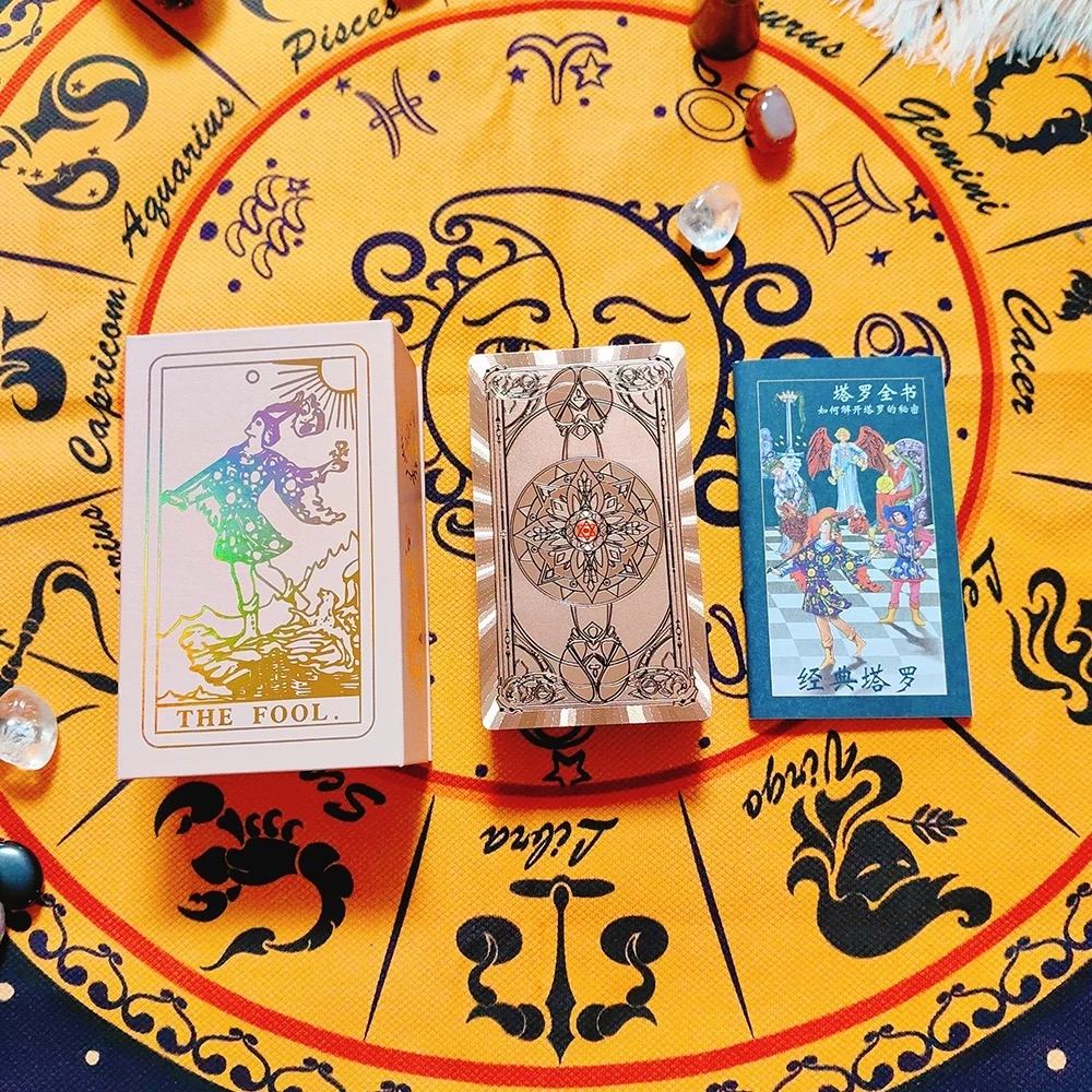 Three Rose Gold Holographic tarot cards on a yellow astrological chart with zodiac signs.