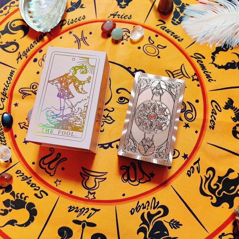 Two Rose Gold Holographic tarot cards on a yellow circular table with astrological signs