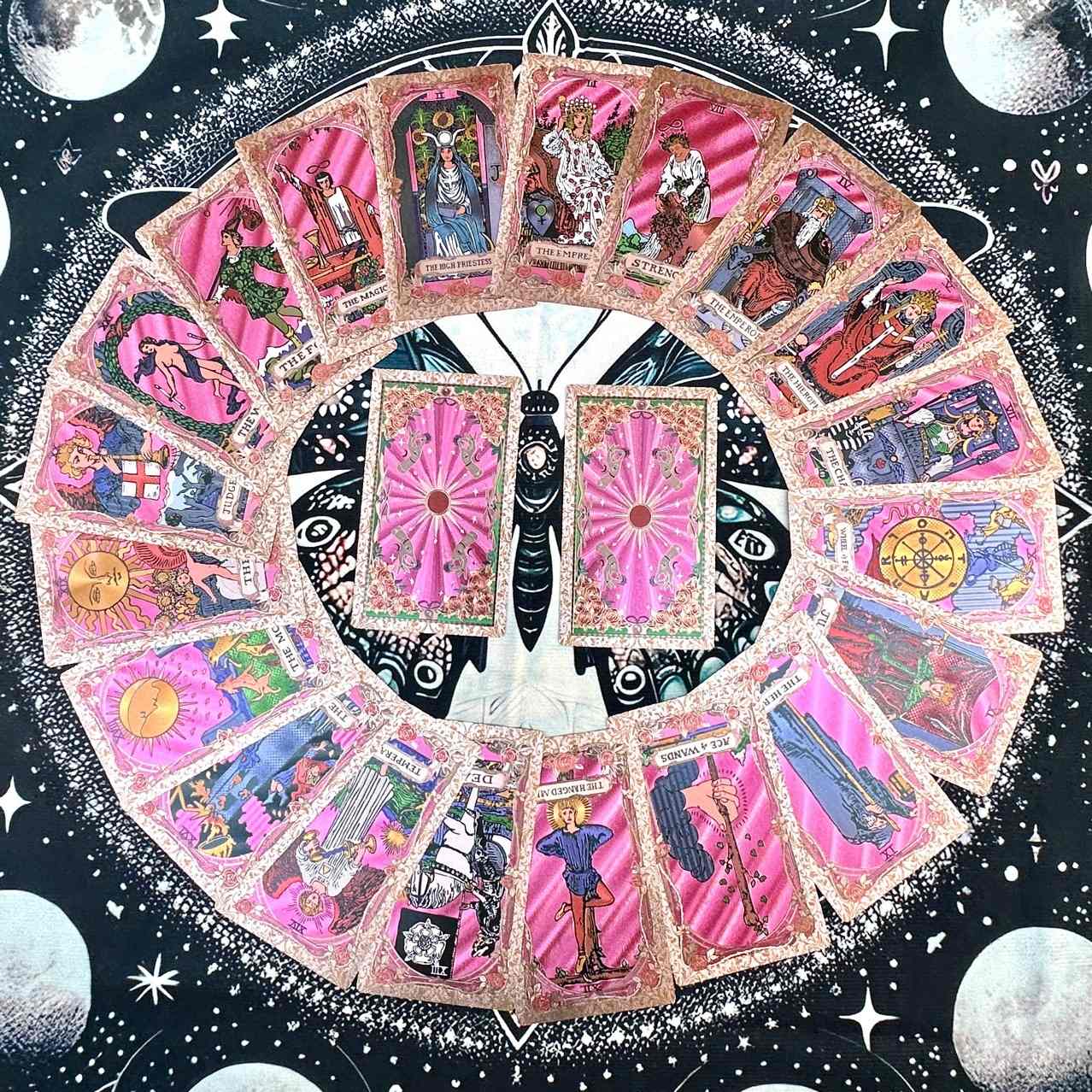 Circular arrangement of foil tarot cards with a starry night sky design.