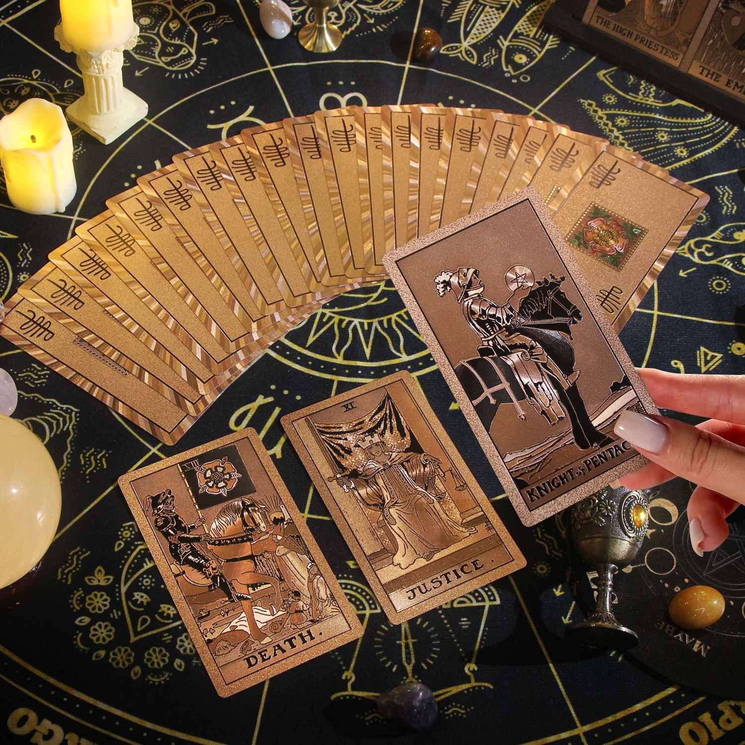 Rose Gold Foil Tarot cards on a mystical table with candles and symbols