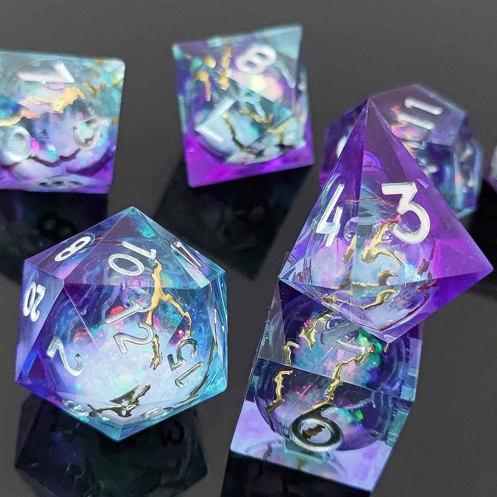 Set of colorful  liquid core resin  polyhedral dice with numbers on a dark background