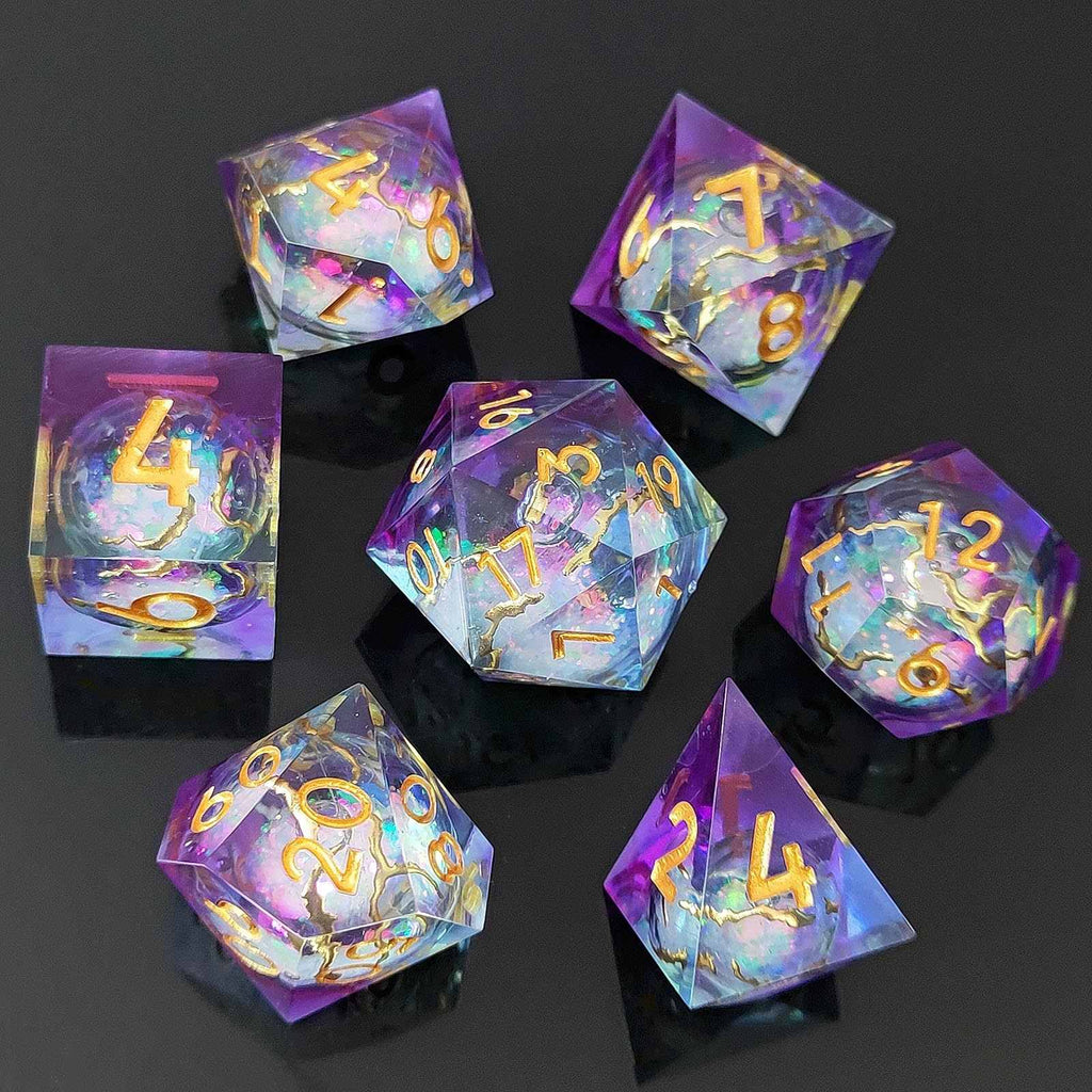 Set of colorful liquid core resin polyhedral dice with numbers on a dark background