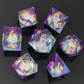 Set of colorful liquid core resin polyhedral dice with numbers on a dark background