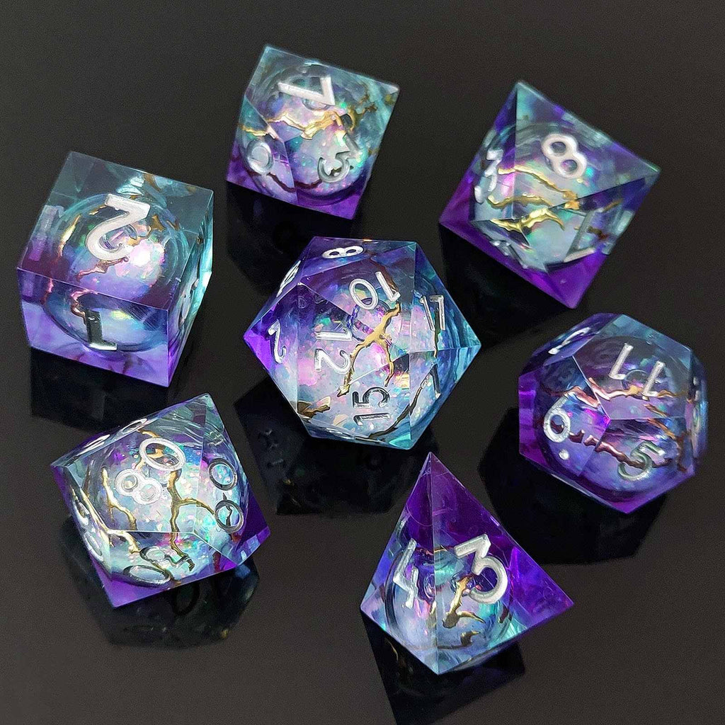 Set of colorful liquid core resin polyhedral dice with numbers on a dark background