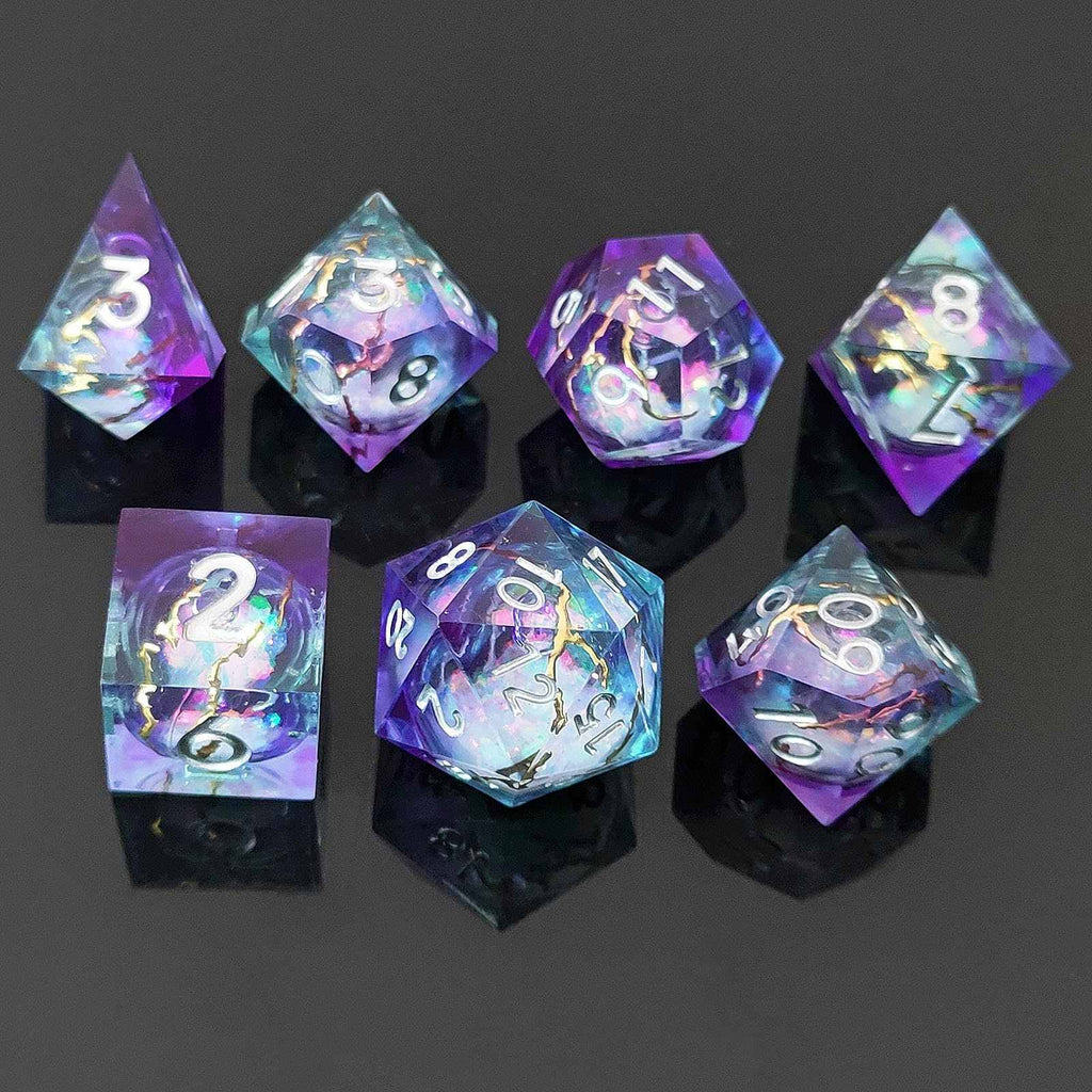 Set of colorful liquid core resin polyhedral dice on black stands against a dark background