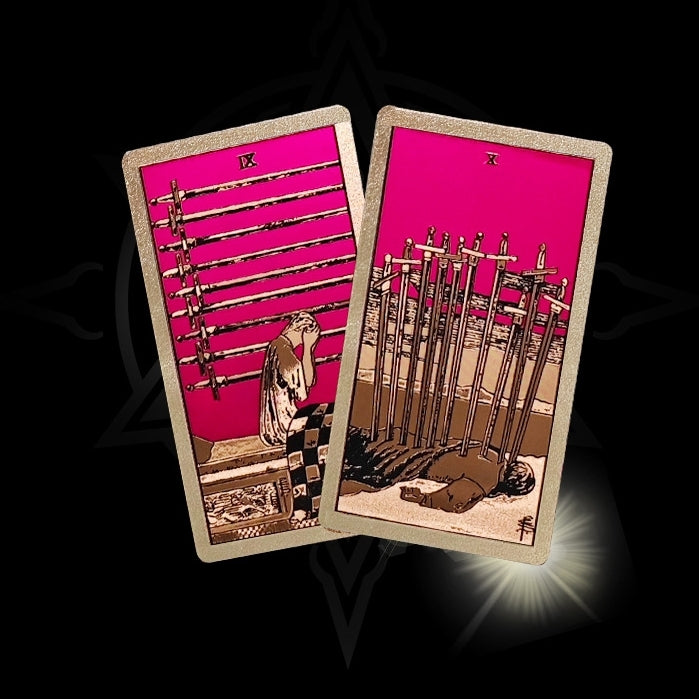 Two Gold Foil tarot cards with a red background and intricate designs on a black background