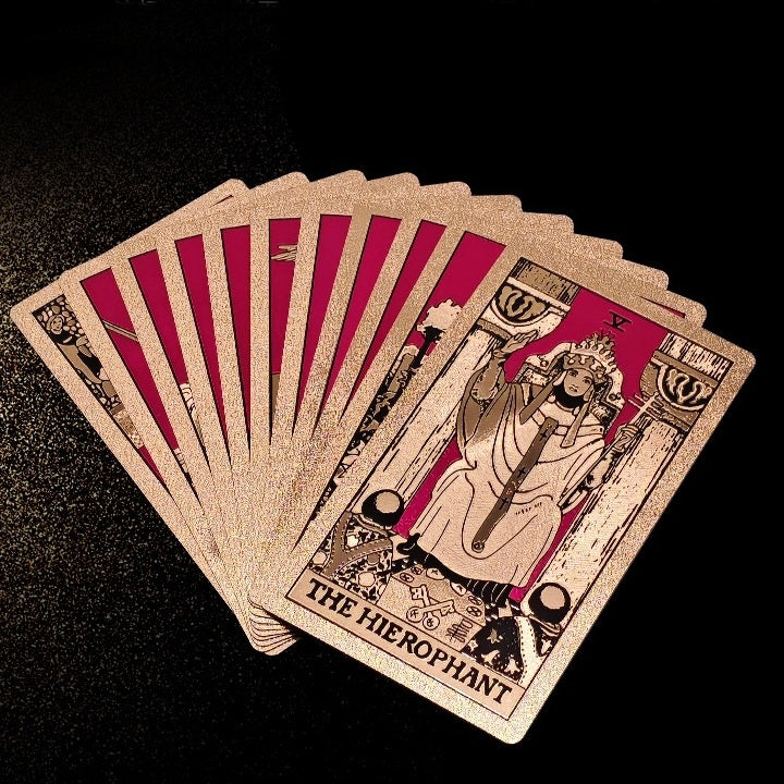 Fanned deck of Gold Foil tarot cards with 'The Hierophant' card prominently displayed on a black background.