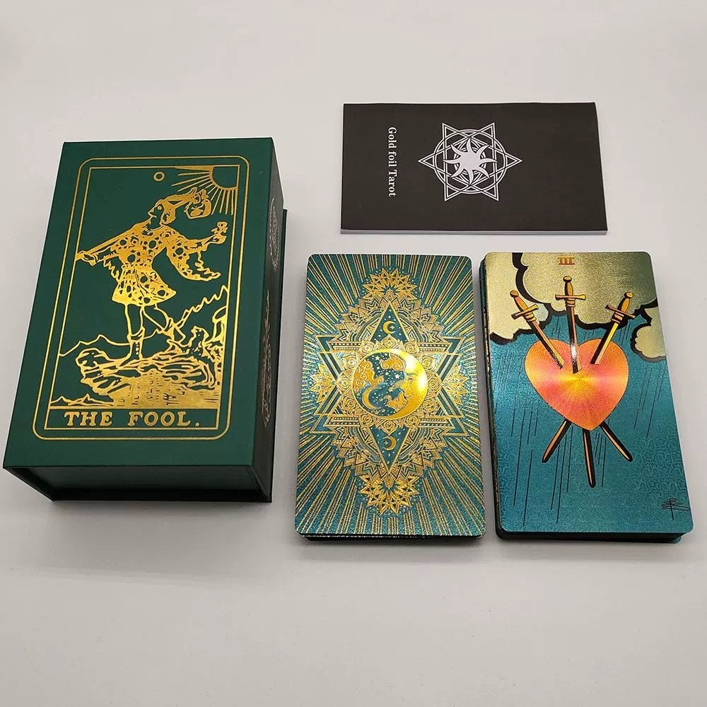 Collection of Teal Foil tarot cards with intricate designs on a gray background