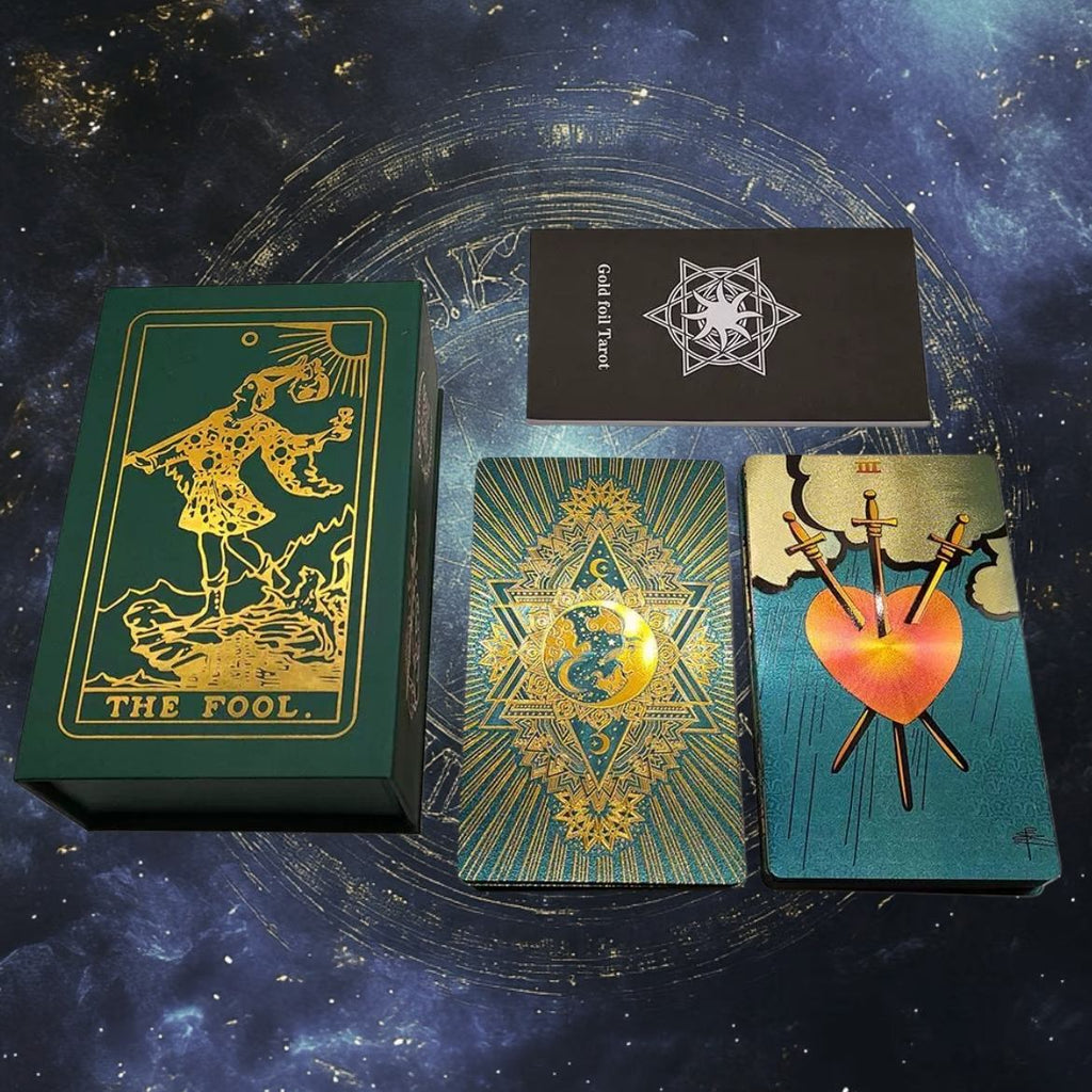 Collection of Teal Foil tarot cards with decorative designs on a starry night sky background