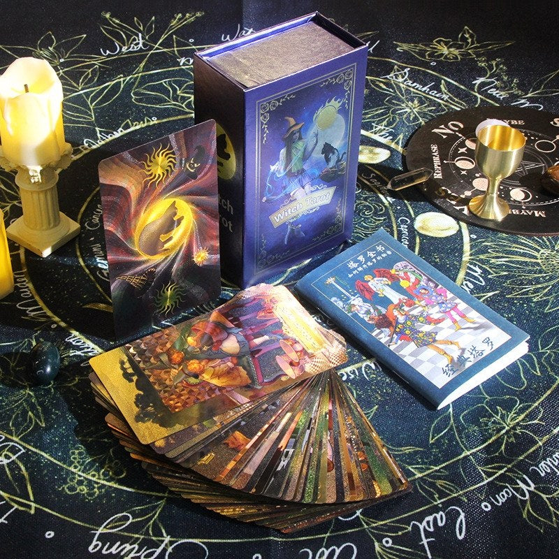 witch gold foil Tarot cards and deck on a mystical table with candles and symbols